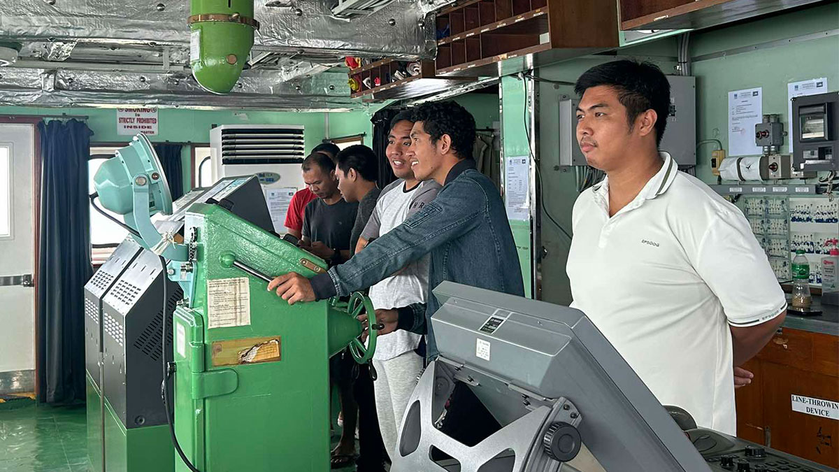 T/S Felix Oca third officer Eleazar Dimabuyo (right), along with other crew members, inside the ship's bridge. INQUIRER.net/ Faith Argosino